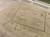 A drone image of the 'Postcard from the Edge' to the Prime Minister, which was created on Skegness beach.