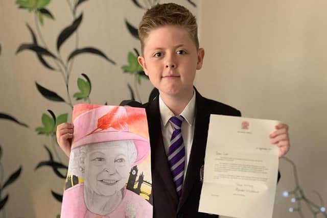 Scott Kami with his winning drawing of the Queen and the letter he received from Balmoral Castle