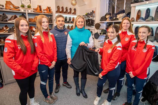 From left: Horncastle footballers Megan Gelder, Jess Frick, coach Jamie Town, Joanne Holderness of Shoes by Grace, Liv Town, Maisie Farrington and Olivia Sausby-Gallimore