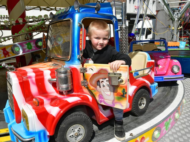 Riley Haigh, aged 6, of Boston, enjoys one of the rides.
