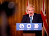 Boris Johnson speaks during a virtual press conference inside 10 Downing Street this afternoon (Photo by TOLGA AKMEN/AFP via Getty Images)