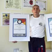 Holding up some of his Official Record Breakers certificates, John Stephenson, of Donington.