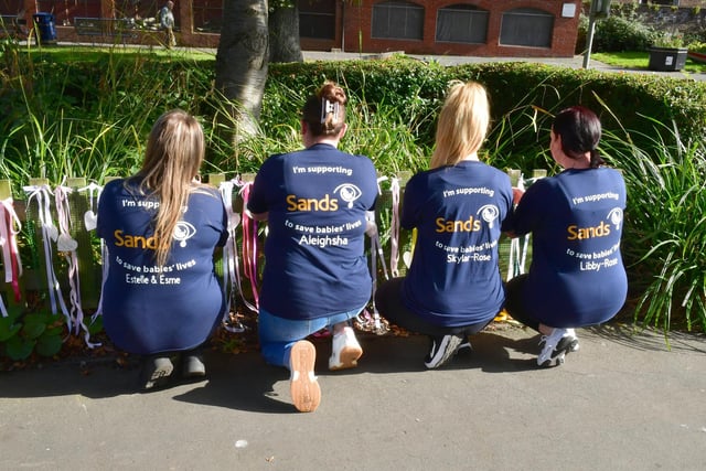 The four mums wearing their shirts in support of the baby and pregnancy loss charity SANDS.