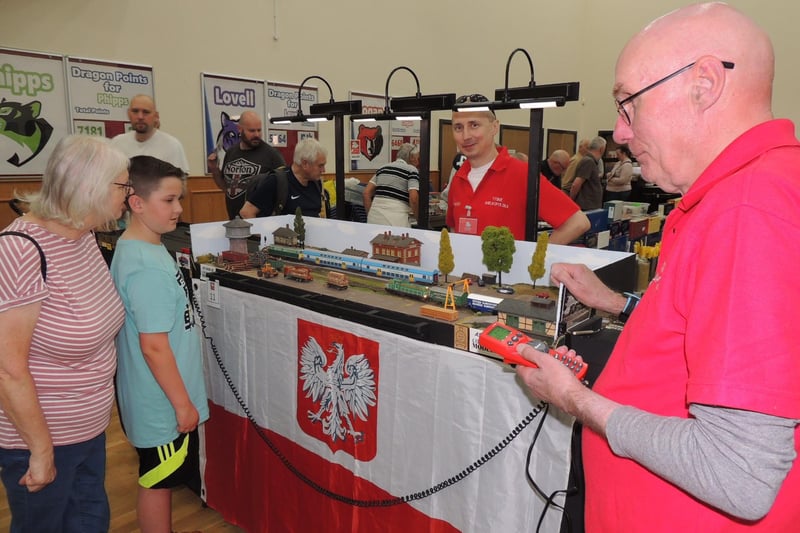 A layout of a station in western Poland by these two modellers from Doncaster, Maciej Kurkowiak and Alan Wardman watched by Julia Wing and Isaac Harrison of Sleaford.