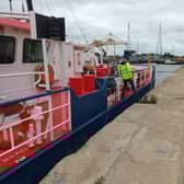 Officers boarding a vessel at the Port of Boston.