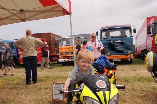 Jack Roy Scowen, aged two, from Goxhill, tries a machine for size on the Lincolnshire Blood Bikes charity stand.