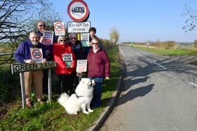 Thimbleby residents campaigning for 30mph speed limit, from left: John Swinn, Mike Clarke, Chris Holmes, Dennis Holmes, Jonathan Lincoln and Jan Clarke with her dog Alek. Photo:
