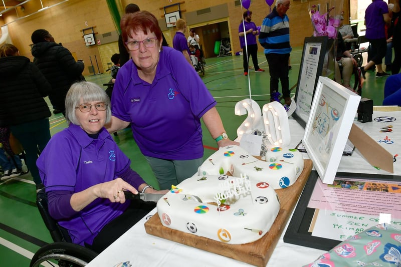 L-R Thelma Smith - Sleaford Laffletics Club founder, cutting the cake, with club chairman Gail Martin. Photo: David Dawson