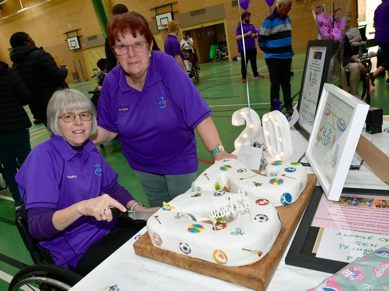 L-R Thelma Smith - Sleaford Laffletics Club founder, cutting the cake, with club chairman Gail Martin. Photo: David Dawson