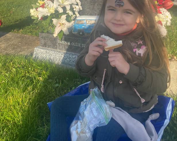 Beau Bolton visits her dad's grave in Harworth Cemetery.