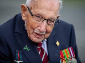 Captain Sir Tom Moore, seen visiting the Army Foundation College, Harrogate, has tested positive for Covid, his family say.