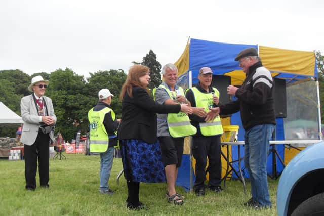 Mayor Julia Simmons (centre) hands out awards.