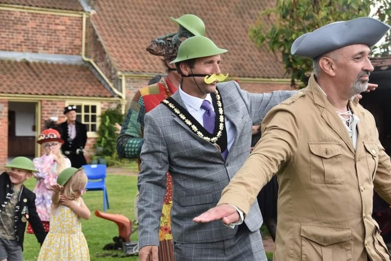 Mayor of Skegness Coun Adrian Findley (second right) gets a flying lesson.
