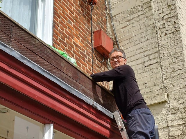 Gordon Rogers got planting high above the shops