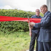 Group Captain Lewis Cunningham, officer commanding RAF Coningsby, opening the Dakota hangar. Photo: Holly Parkinson