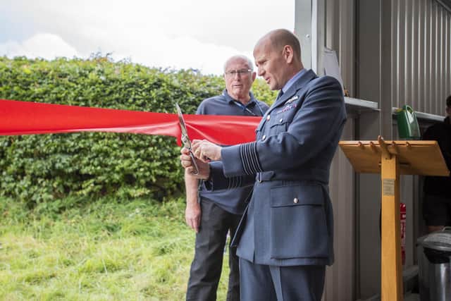 Group Captain Lewis Cunningham, officer commanding RAF Coningsby, opening the Dakota hangar. Photo: Holly Parkinson