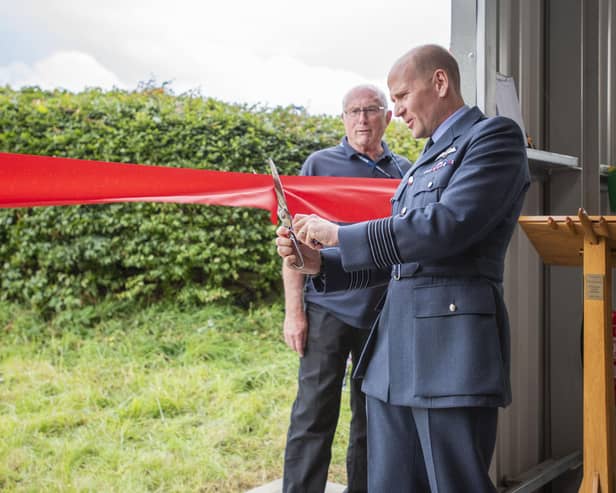 Group Captain Lewis Cunningham, officer commanding RAF Coningsby, opening the Dakota hangar. Photo: Holly Parkinson
