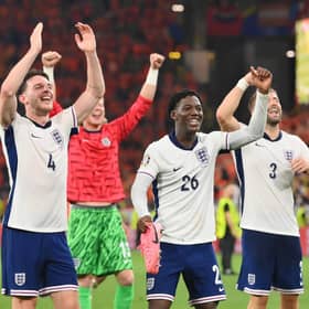 Declan Rice, Kobbie Mainoo and Luke Shaw celebrate after England beat the Netherlands during the UEFA EURO 2024 semi-final match.