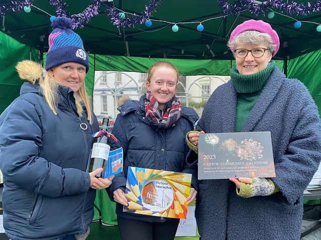 Lindsey and Charlotte Davey with Jane Anderson and the colourful Caistor Community Calendar