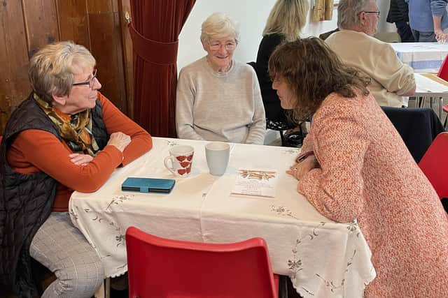 Victoria Atkins MP chats with some of the volunteers