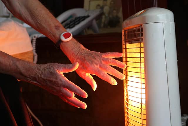 File photo dated of a 19/11/14 of an elderly lady with her electric fire on at home in Liverpool. A "significant humanitarian crisis with millions of children's development blighted" is on the way if the Government does not act to prevent more than half of UK households plunging into fuel poverty, experts have warned. Issue date: Thursday September 1, 2022.