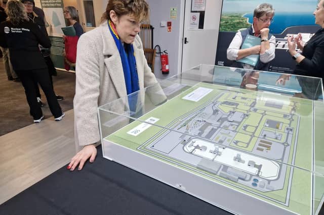 MP Victoria Atkins studying a model of the possible nuclear waste dump on agricultural land between the villages of Gayton le Marsh and Great Carlton.