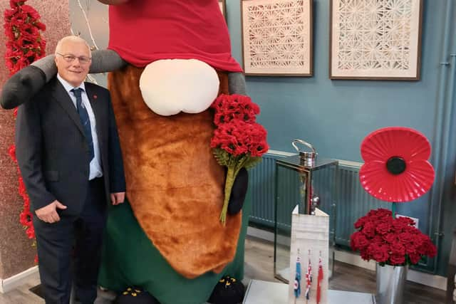 Council leader Coun Paul Skinner with the giant 'gonk' at Cafe Noglish in Boston.