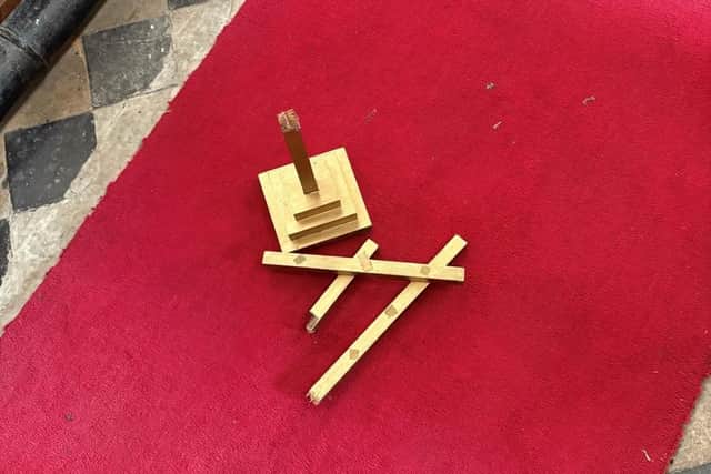 The wooden table cross smashed into pieces at St Helen's Church, West Keal. Photo: Lincs Police