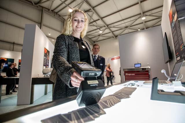 Steph Leaver, BAE Systems' technology development engineer, demonstrates the passive RF tags.