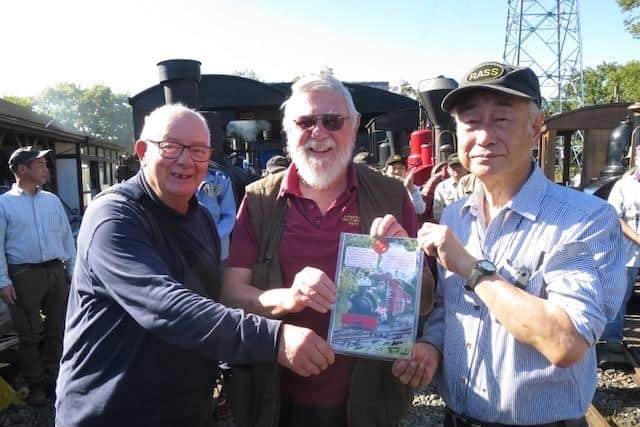 The presentation marking the friendship between two of the world’s pioneering heritage railways. Pictured (from left) are Chris Bates and John Raby of the Lincolnshire Coast Light Railway, Skegness and Yukihiro Tsunoda of the Rass Chijin Railway Society; Photo: Takuro Takahashi/Rass Chijin 2024.