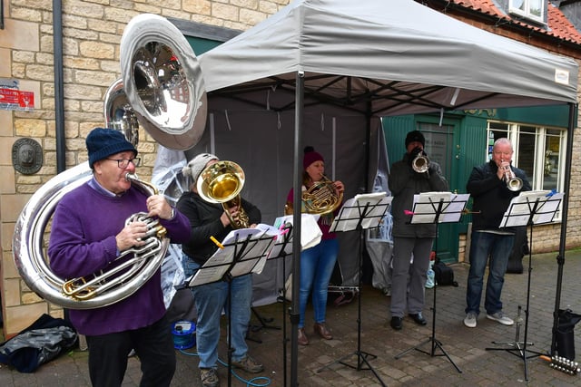 Sleaford Concert Band members performing Christmas tunes in Millstream Square.