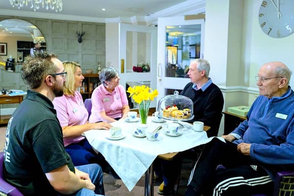 Stewart (left) and James (right) enjoying tea and cake with the home.