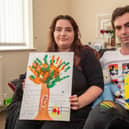 Andrea and Brad with the keepsakes they made of baby Noah.