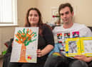 Andrea and Brad with the keepsakes they made of baby Noah.