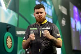 Boston' Scott Williams celebrates during his quarter final win against Michael van Gerwen at the Paddy Power World Darts Championship.