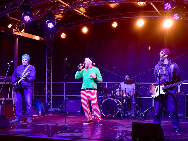 Revolver performing on stage.