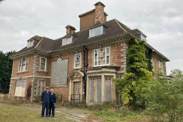 Charles and Sally Pinchbeck in front of Heckington Manor on the day they bought it in 2020. Photo: Charles Pinchbeck