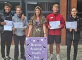 Emma Day, Executive Principal at Skegness Academy, (centre) with students celebrating their A-level results.