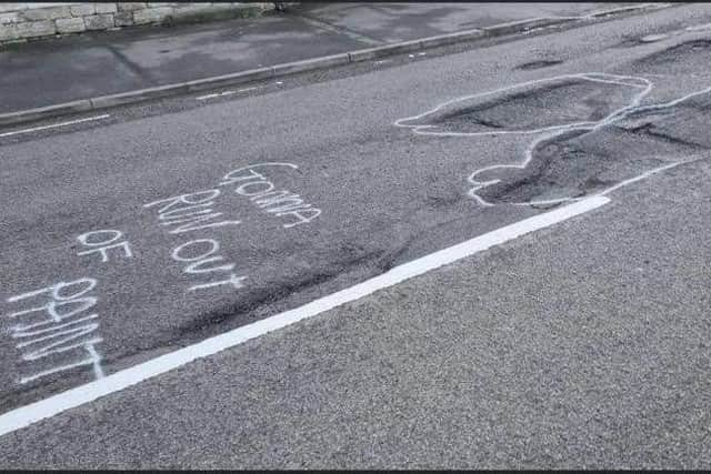 Pothole 'Banksy' in Ancaster.