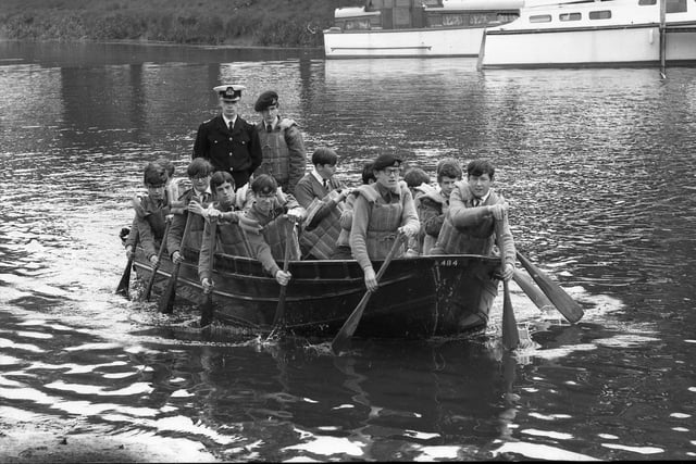 The re-formed naval section of Boston Grammar School CCF demonstrating the use of an assault boat on the Witham near Sluice Bridge.