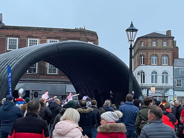 Top Queen tribute act Supersonic Queen performing at the rain-drenched Jubilee Party in the Market Place in Boston.