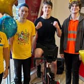 Pedalling for Pudsey - from left - Kerri Foster from Barclays, Lee Taylor, Will Chenary on the bike and Kyle McDonald at Sleaford Post Office. Photo supplied