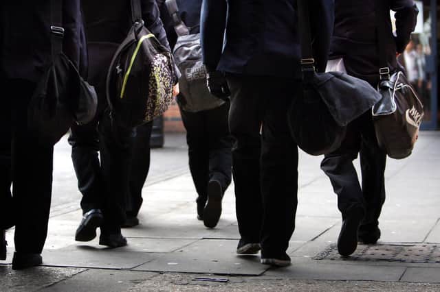 File photo dated 26/01/12 of school pupils, as nearly nine in 10 schools in England are providing uniforms and clothing to some pupils as the cost-of-living crisis continues to bite, a report suggests.