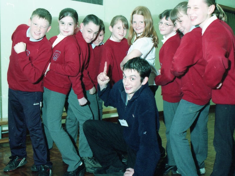 Youngsters from Boston West School playing host to the Yellowbelly Theatre Company. Alice's Adventures in Wonderland was the focus for the day. Pictured with the pupils is theatre in Education actor Duncan Johnson.