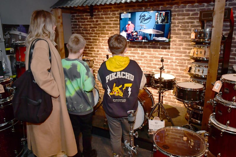 Supporters watching Ben on a live stream at Into Music drum store near Horncastle.