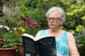 Flo Moore reading one of the books