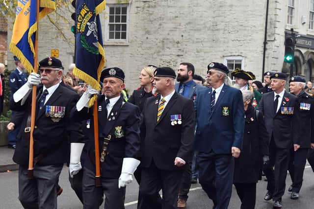 Alan Robbin (left) and Rob Wells lead the veterans march past.
