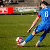 Skipper, Dylan Cogill in action away at Workington
