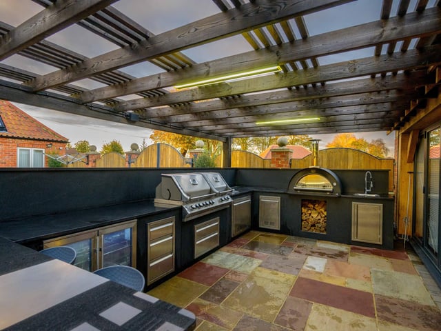 The outdoor kitchen.