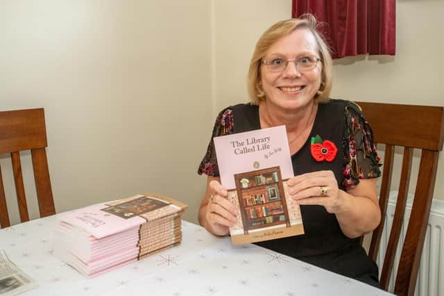Helen Pearson with her book A Library Called Life.